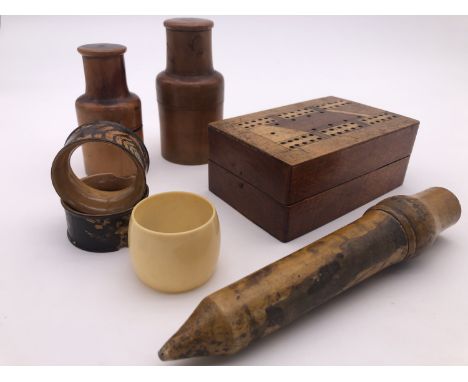[Treen] A 19th Century turned wooden glass syringe case, two pharmacist's jars in turned cases, a cribbage board and napkin r