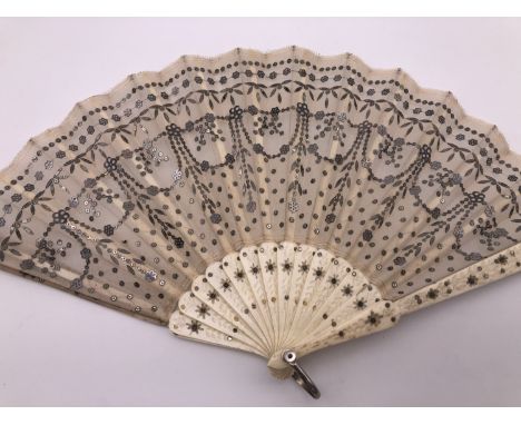 Two vintage hand fans, one having a tulle leaf with applied silver spangles and carved bone sticks, the other with Japanned s