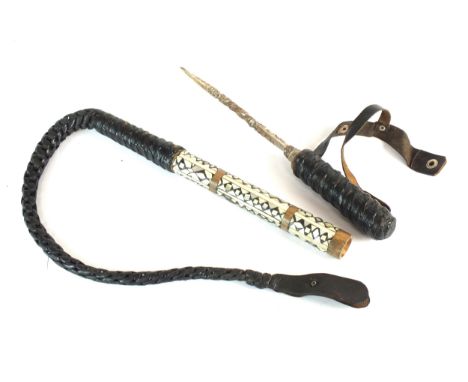 An early 20th-century North African camel whip, the mother-of-pearl, ebony and bone scabbard unscrewing to reveal a steel bla