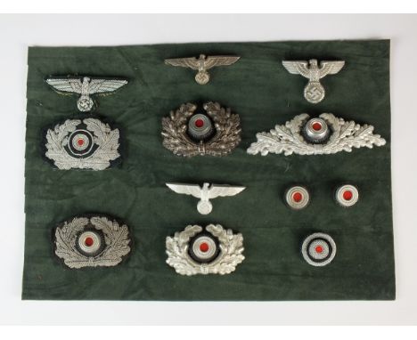A group of German Third Reich visor cap insignia comprising the following wreaths and eagles with cockades: State Forestry Se