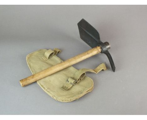 A British WW2 entrenching tool by Perks, dated 1944 below War Department arrow, comprising pick head, wooden helve and webbin