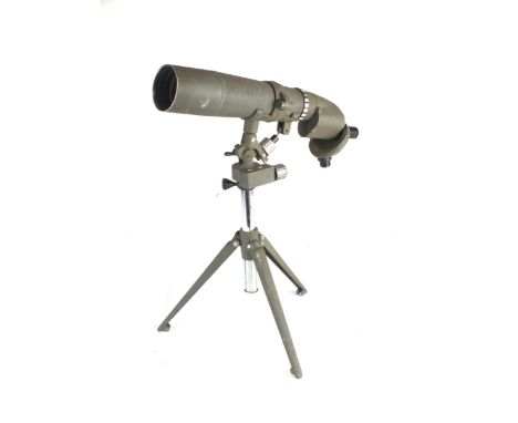 An Eastern European spotting scope in tripod stand, painted in field grey and with revolving multiple eyepieces for 20x30 x40