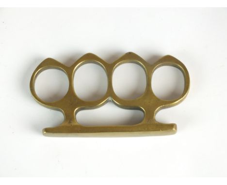 A First World War brass trench warfare knuckleduster, unmarked but almost identical to known British Army Special Operations 