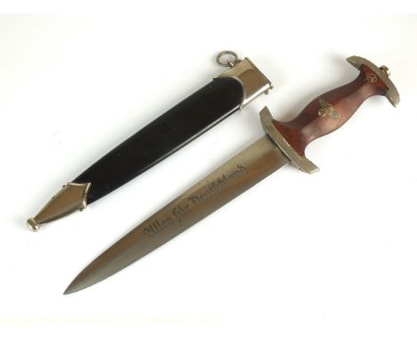 A German Third Reich NSKK Dress dagger by Carl Westhoff Solingen the dark brown wooden grip with inlaid metal eagle and ename