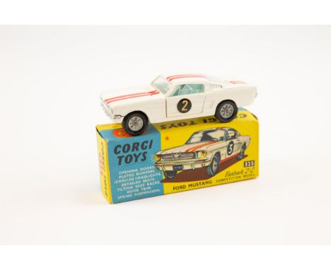 Corgi No.325 Ford Mustang fastback 2+2 in white with red stripe running accross the drivers side, This is left hand drive. Ha