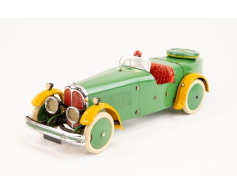 A rare 1930's No.2 Meccano Constructor Car. A boat tail example in green with yellow mudguards, red seat, green wheels with w