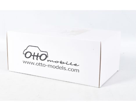 A BOXED OTTO MOBILE TRIUMPH TR7 GROUPE B 1:18 MODEL RACE CAR, numbered OT220 UVI, red, white and blue in colour with advertis