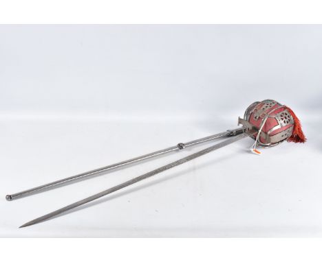 A SCOTTISH OFFICERS BASKET HILT SWORD, the blade has got ornate decoration on it but this is rubbed in places, there is the r