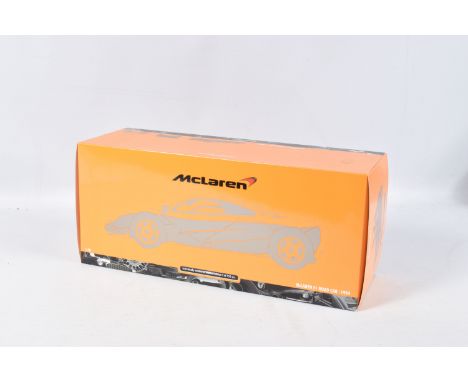 A BOXED MINICHAMPS MCLAREN F1 ROAD CAR 1994 1:18 MODEL VEHICLE, numbered 530 133421, painted orange, appears in new condition