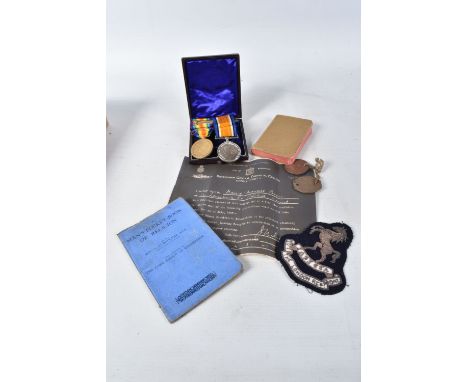 A PAIR OF WWI MEDALS, DOG TAGS, BIBLE ETC, the medals are correctly named to PVT G-34605 W.M.Cooper 20- LOND- R, the 2oth Lon