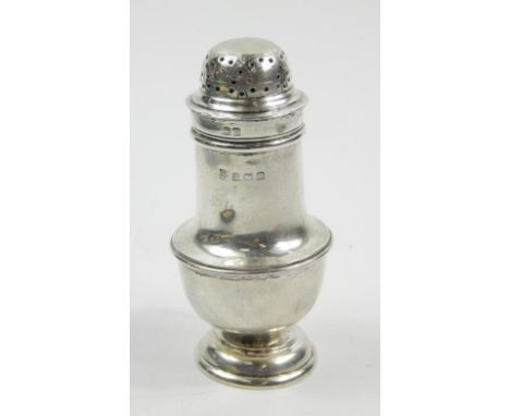 A George V silver pepper pot, with a domed pierced lid and belied body, Birmingham 1960, 11cm high, 2.5oz.