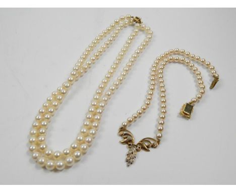A pearl double row necklace and costume pearl necklace.
