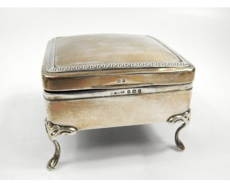 A George V silver trinket box, with domed square rounded top with outer Greek key design and central (vacant) cartouche, hing