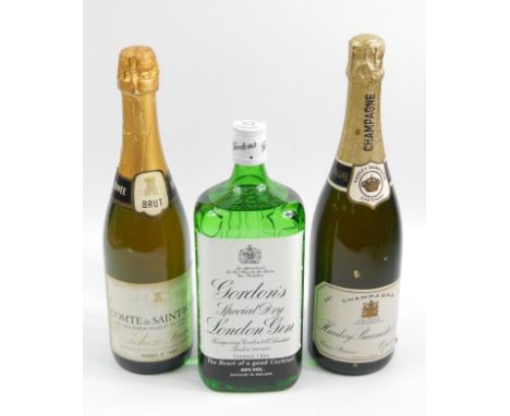 A bottle of Champagne made by Hanky Bannister & Co, a bottle of Compte de Saint-fort sparkling wine, and an unopened bottle o