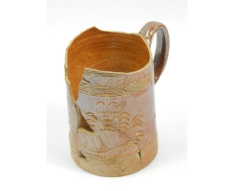 A part stoneware tankard, the cylindrical body raised with a coat of arms with an upper naive banding and plain handle with A