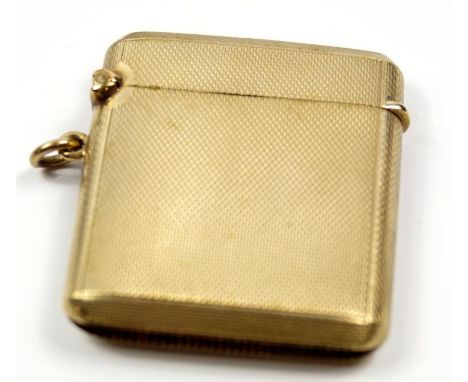 A 9ct gold vesta case, with engine turned decoration, London Assay, 28.1g.