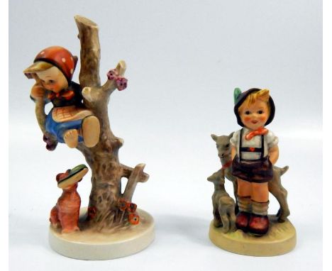 A pair of Goebel figures, one in the form of a boy with goats, entitled Little Goat Herder, the other in the form of a young 