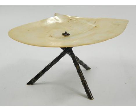 An Edwardian silver plated and nacre dish, the shaped top on bamboo style support, 11cm high.