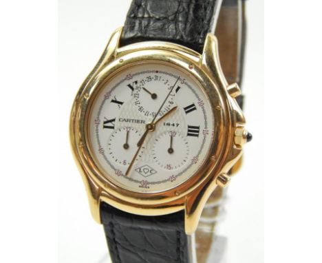 A Cartier 1847 Cougar 18ct gold chronograph wristwatch, with white dial and black leather strap, bearing serial no. C32061 (1