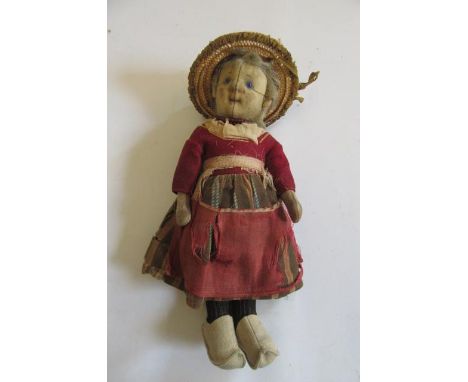 A Steiff stuffed felt girl doll, c.1913, with stitched moulded face, blue glass eyes, blonde mohair wig, original costume (pa