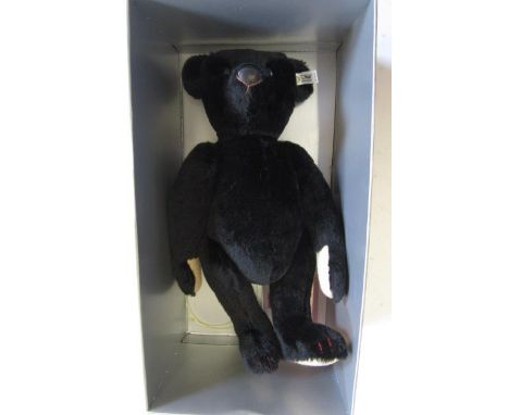 A Steiff replica "Schwarzbar 1907" bear in black plush, leather snout, fawn pads, label to ear, 16" high, boxed with certific