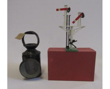 A Midland Railway coach lamp, circular black japanned metal with burner and reservoir, green and red inner lenses, No.14779B,