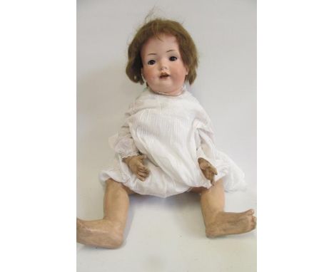 A Bahr &amp; Proschild bisque head doll with brown glass sleeping eyes, open mouth and teeth, brown mohair wig, composition b