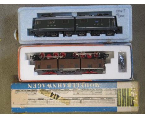 Three HO scale locomotives comprising Roco BRE91, Piko Class 118, and unknown SBB RE4/4/4 11602 with diecast body, Loco locom