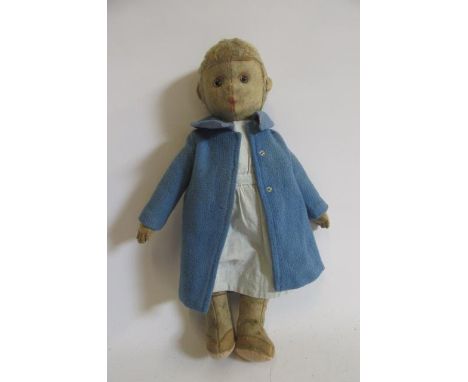 An early Steiff type with felt covering, clear/black eyes, blonde plush hair, later foot pads, later clothing, 18" high (Est.