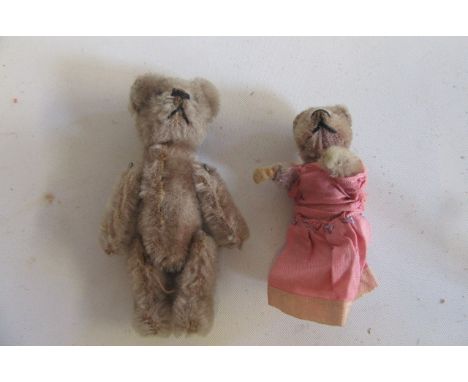 A "Picolo" Schuco miniature teddy bear with black button eyes, felt hands/feet, 2 1/4" high, and a Schuco miniature teddy bea