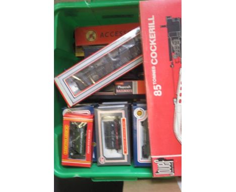 Twenty five goods trucks by Bachmann, Hornby, Lima and others including PO wagons, coal truck, box vans and crane, all items 