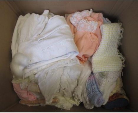A large quantity of dolls clothing including boots, shoes, hats, and hangers, in wool, lace, cotton and muslin, and three Ste