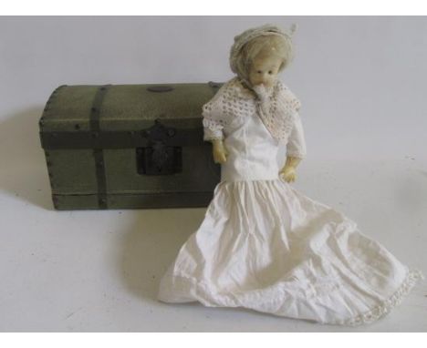 A wax lay figure with inset blue glass eyes, blonde mohair wig and fabric covered body, 9 1/2" high, in fabric covered domed 