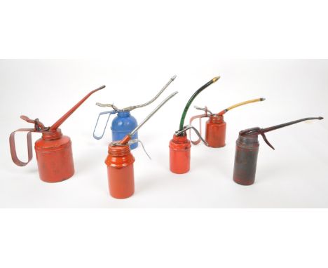 A collection of six vintage 20th-century oil dispensing cans, painted in red, blue, and grey. Numbered to the base of each ca