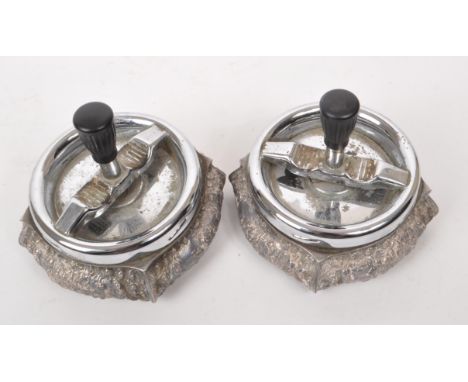 Two vintage mid century Dutch silver plated zilpla 90 roulette ashtrays, featuring ornate relief decoration to the body and a