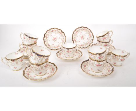 Coalport - An early 20th-century porcelain eleven-person tea / coffee service set. Includes eleven cups and saucers. It featu