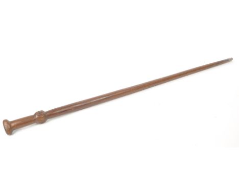 A vintage early 20th century wooden walking stick, with a hand carved handle and collar, and brass ferrule. Measuring approx.