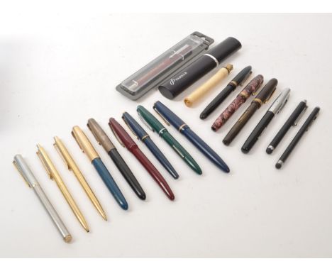A collection of assorted vintage fountain and ballpoint pens, including names such as Conway Stewart, Parker, Swan, Platignum
