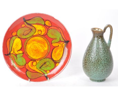 Two 20th century pieces of pottery, comprised of a West German crackle glaze jug, with gilt decorated rim and a Poole pottery