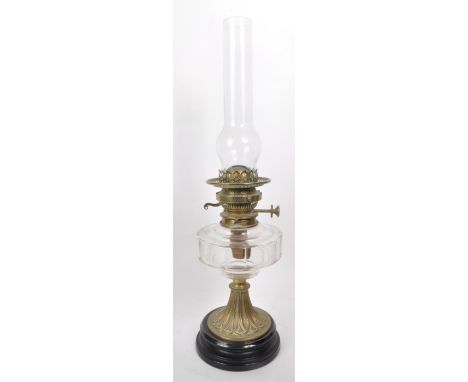 A Victorian 19th century Messenger's patent oil lamp, featuring brass body and burner, glass bowl and raised on a ceramic pli