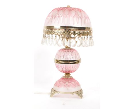 A vintage 20th French crystal boudoir table lamp. The lamp having pink etched glass shade, reservoir and base with gilt metal