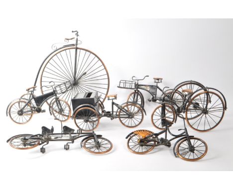 Collection of cast metal vintage bicycle ornaments to include shop bikes, penny farthing etc.