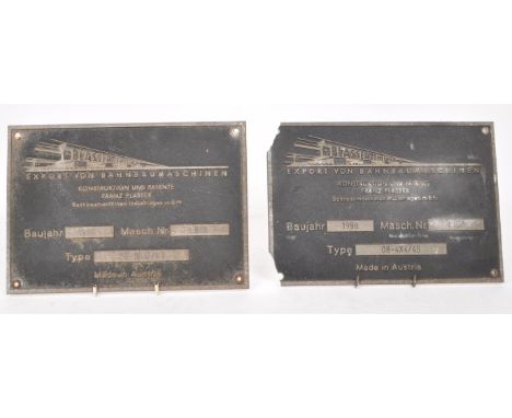 Two vintage late 20th century Austrian train equipment metal signs, dated 1998 and 1999. Titled 'Export of Railway Constructi