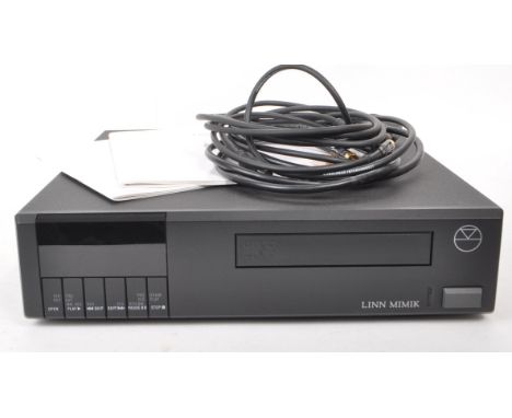 A 1999 Linn Mimik compact disc digital audio CD player, with the owners manual present. Measuring approx. 7.5cm x 32cm x 32cm
