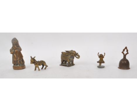 A collection of five vintage bronze sculptures / pieces, including a bell, a donkey, a girl, an elephant and a girl statue. L