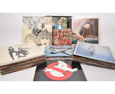 A collection of vintage 60s / 70s / 80s vinyl LPs and 45" singles, featuring artists such as 'The Beatles', 'ABBA', Fleetwood