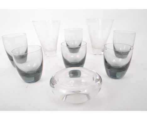 A collection of mid-20th-century drinking glass pieces, comprised of six believed to be Georg Jensen smoked glass tumblers, a