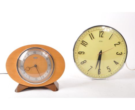 Metamec - Two vintage mid 20th century Metamec clocks. The collection consisting of a chrome wall clock, with yellow face, al