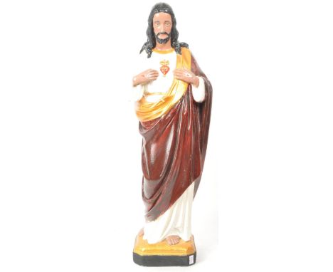 A large vintage 20th century plaster Jesus mantel figure sculpture, hand painted with gilt detailing to the base and clothes.