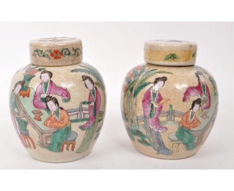 Two Chinese 19th century crackle glaze ceramic lidded ginger jars, featuring hand painted figures and plants to the body. Eac